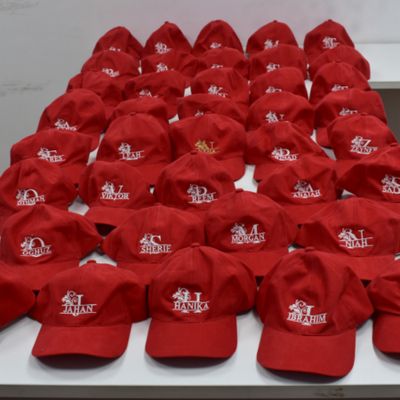 emboridered red caps